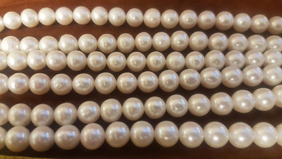 AA+ grade 8-9mm oval freshwater pearls for jewelry designers. Full string is 15 inches. ideal for crafting necklaces. 10, 15 & 20 available.