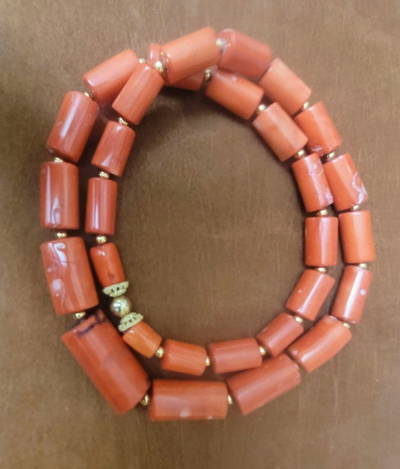33"  Salmon barrel coral Nigerian design simple beaded necklace. Simple and dynamic. Wearable by men or women. REDUCED!!!