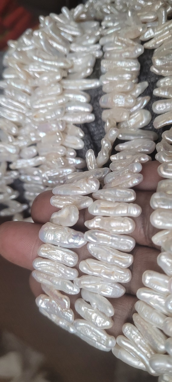 Biwa souffle baroque pearls 15x5mm approx. Each strings is 15 inches long. High luster, beautiful top quality pearls. Best ones are here!