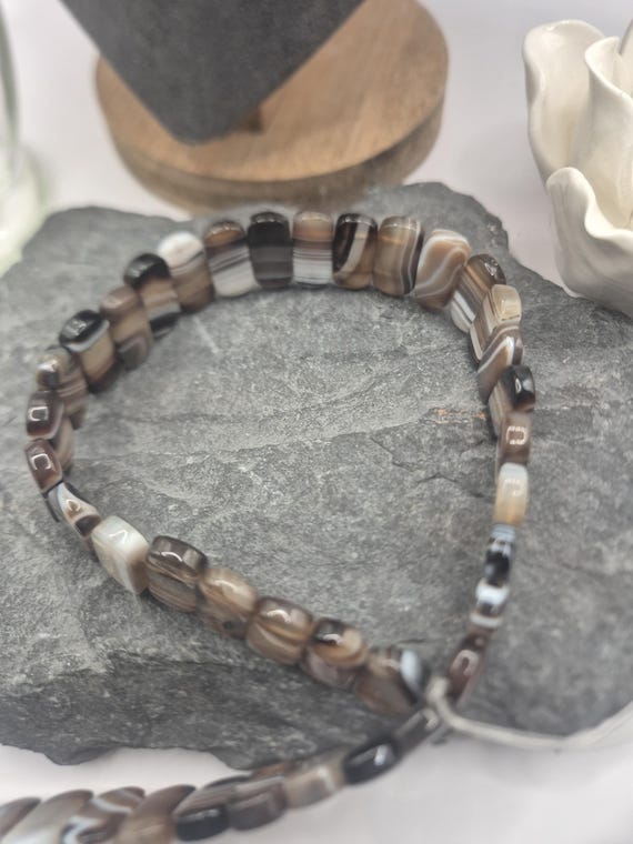 Banded agate, unusual shapes. 10 x 20mm  flat beads. 39 beads per strand. Ideal for making men's bracelets for Father's day. 1 available.