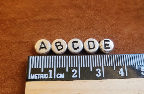 6mm mixed silver & black alphabet coin beads for personalized projects, DIY craft projects, fun jewelry making. Letter beads