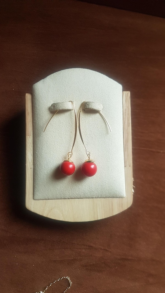 14mm dyed red coral with gold plate earrings. Simple and dynamic. Unusual beads.
