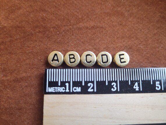 6mm mixed gold & black alphabet coin beads for personalised projects, DIY craft projects, fun jewellery making. Letter beads A to Z