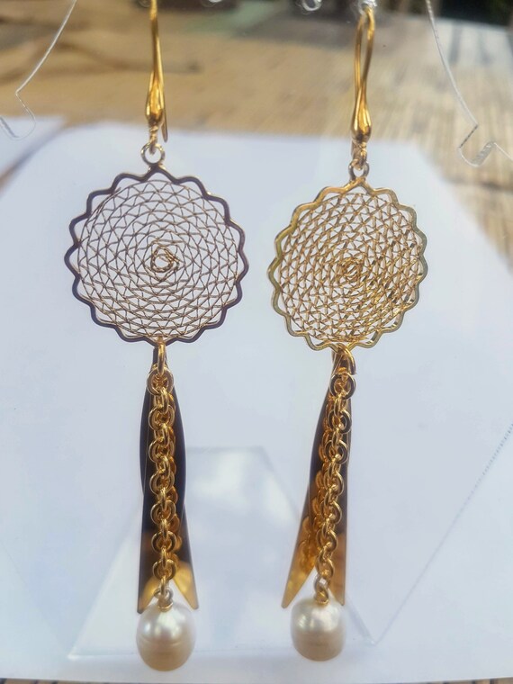 Unique gold and freshwater pearl earrings comes in organza gift bag.