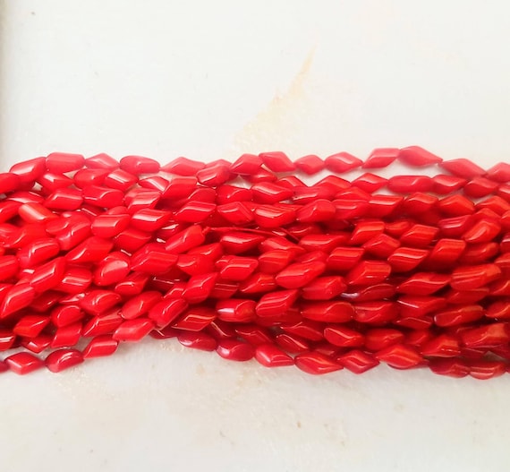 Coral resin red beads. Each strand is 18 inches long. These beads are 8 x 4mm approx.