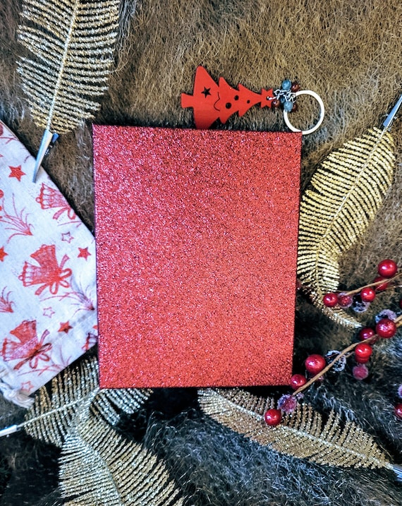 Red/silver glitter gift box. Beautiful Christmas gift boxing for someone special. No wrapping required.