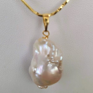 AAA Baroque pearl pendant 20 x 15mm approx. High luster pearl. Each piece is awesome and unique. Chain not included. Gift bagged for you.