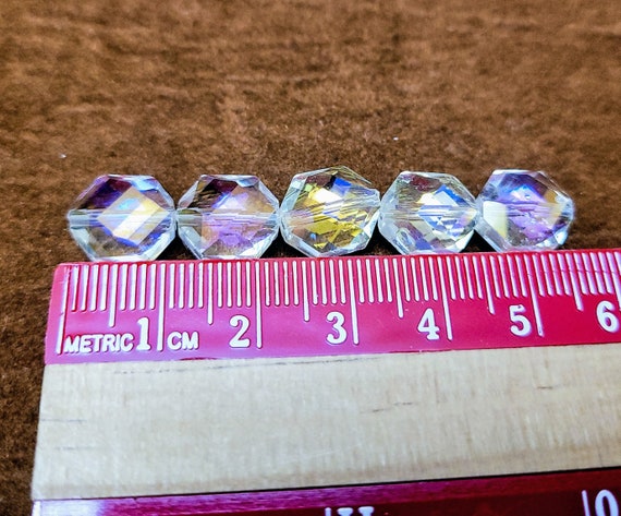 Octagonal faceted crystal beads with AB effect. 8 beads in a pack.