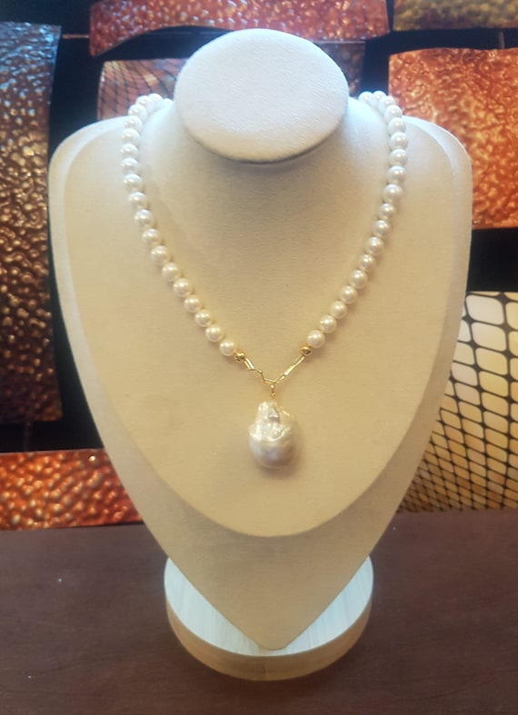 AA+ Freshwater pearl necklace with front baroque 25x18mm approx. Beads are 6mm. Please note Baroque pearls vary in shape & size