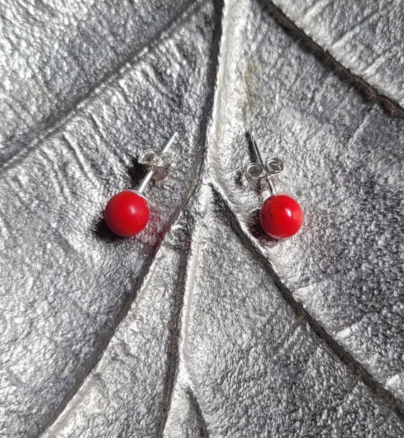 Dyed red coral stud earrings. 6mm diameter.