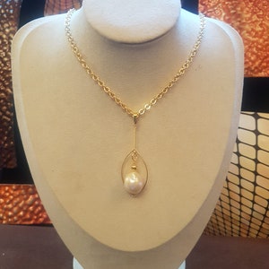 Aesthetic Baroque freshwater pearl pendant 18  x 16mm  with gold-plated detail, 460mm long  chain.