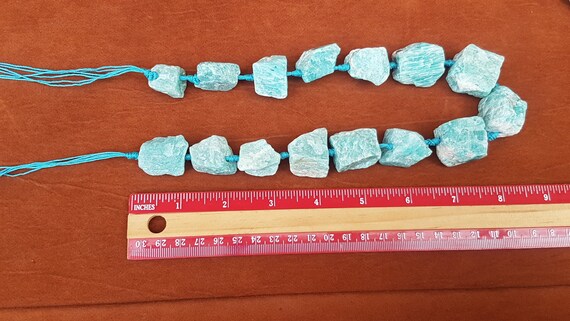 15 Amazonite gemstone beads on a string. Sizes vary from 25 - 15mm. Beautiful & natural. For jewellery or home décor. Price for whole strand