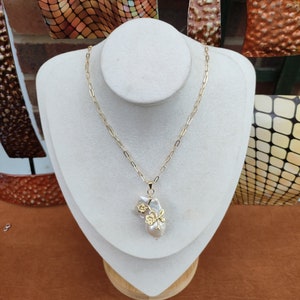 Large baroque pearl pendant 30 x 35mm approx. High luster pearl. This piece is awesome & unique. Very beautiful. Pendant with 18 inch chain.