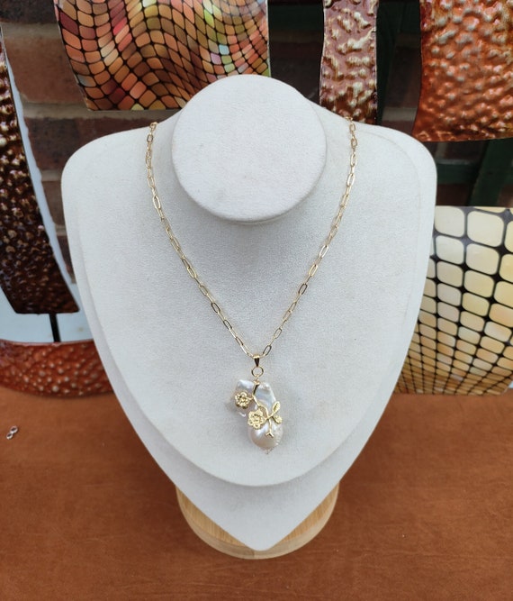 Large baroque pearl pendant 30 x 35mm approx. High luster pearl. This piece is awesome & unique. Very beautiful. Pendant with 18 inch chain.