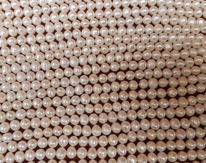 9-10mm Ivory Freshwater oval Pearl Beads: 14-inch Strand. AA+ grade.