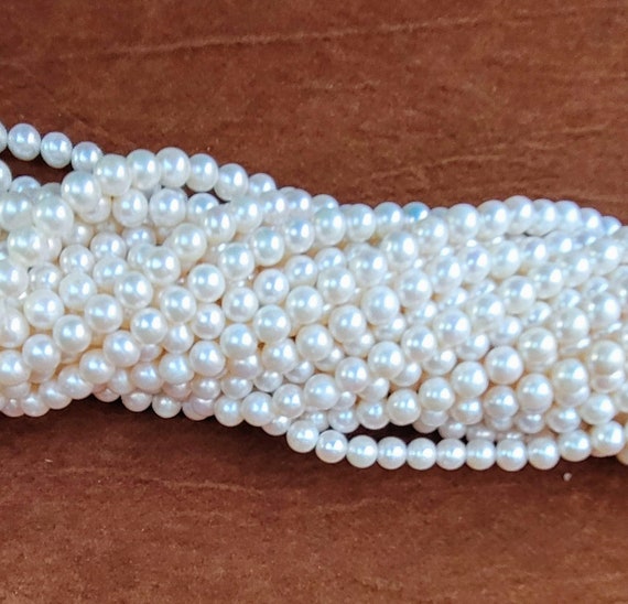 AAA grade real pearls, each with a high luster, measure 6-6.5mm, with a strand length of approx. 40cm, ideal for crafting timeless jewelry.