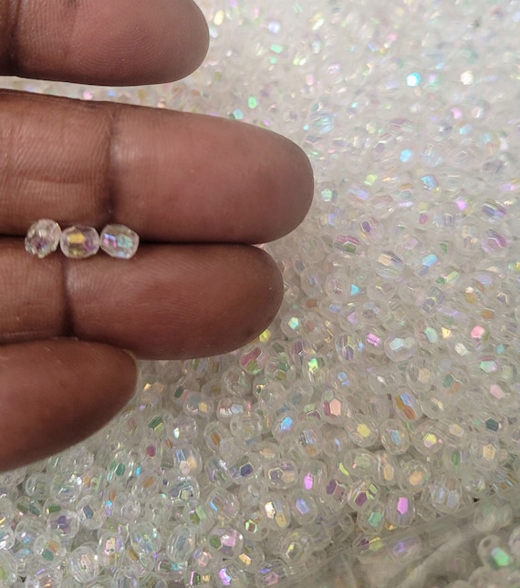 Clear  3x4 mm acrylic, faceted, plastic beads for DIY craft projects, jewellery making, frame decorating.