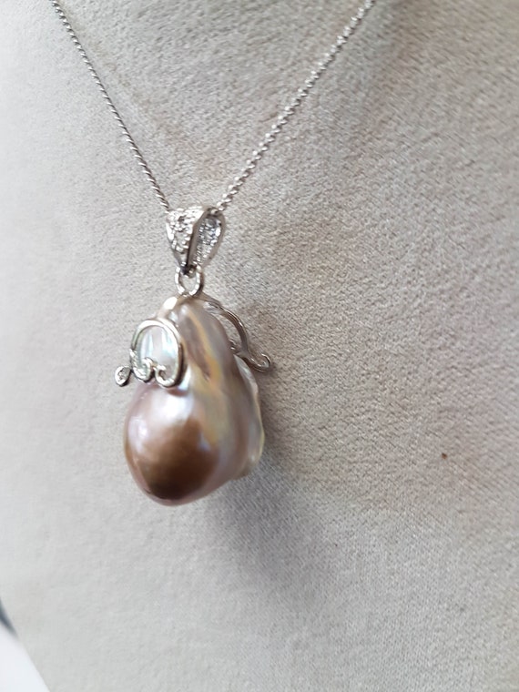 Lovely baroque AAA pearl pendant 15 x 25mm approx. with 925 silver bail & trim. This piece is unique. Chain  not included.