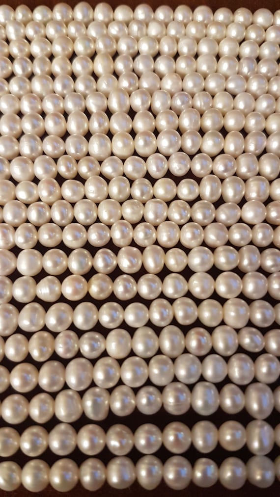 4-5mm ivory baroque nugget freshwater pearls. Each strings is 14 inches long. High luster, beautiful top quality pearls. Best ones are here!