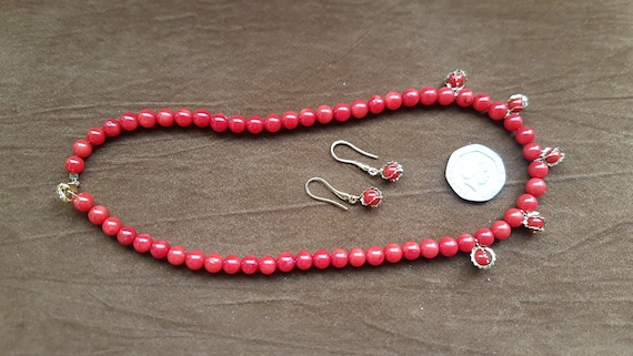 Red coral beaded necklace. Featuring matching charms & earrings, beads are 5mm and the length is 16" making it a wonderful Christmas gift.
