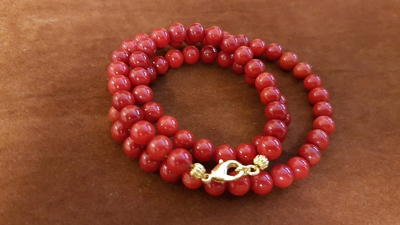 16 inches dyed red coral beaded necklace. This piece is a timeless and versatile accessory, making it an ideal gift for both men and women.