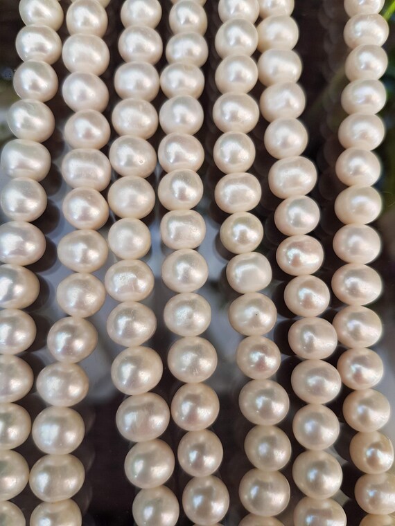 AA+ 10mm  ivory nugget freshwater pearls. Each strings is 15 inches. High luster.