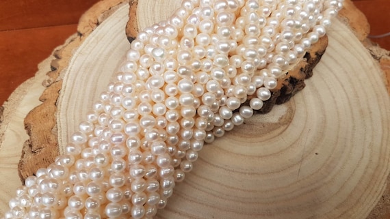 6mm Ivory almost round freshwater pearls. Each strings is 15 inches approx. High luster and top quality pearl.