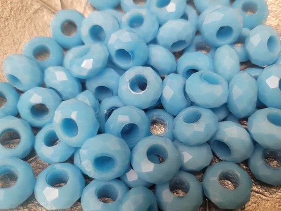 Doughnut glass beads. 15 x 8 mm with 5mm hole. Multifaceted cuts in Turquoise/Black/green/ plum. Large Hole rare beads. 10 in a pack.