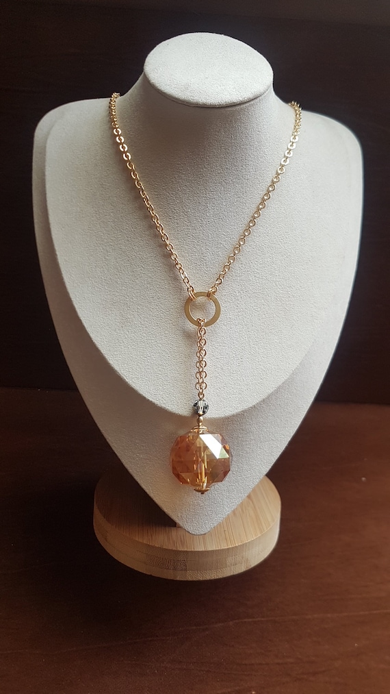Large stunning golden  33mm crystal pendant on a 22" chain. Very beautiful and unique necklace. Make a big statement with this unique piece.