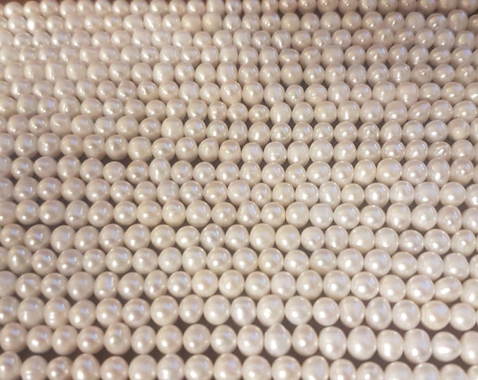 A+ Freshwater Pearl Strand: 12-13mm Baroque Oval Beads, irregular and non-uniform.
