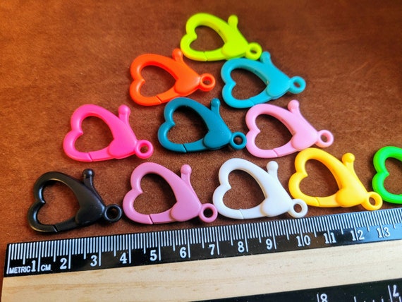 Large heart acrylic lobster claw clasp for all types jewellery projects. All types of craft fun, Plastic clasps. Measures 33x23mm