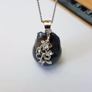 Gorgeous Grey baroque AAAA pearl pendant 15 x 25mm approx. with 925 silver bail & trim. This piece is unique. Chain  not included.