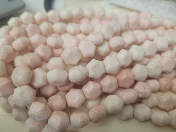Pale pink coral hexagonal loose beads on a string, 15 inches long. Rare & Beautiful texture. Beads are 12mm x 8mm. Perforated beads.