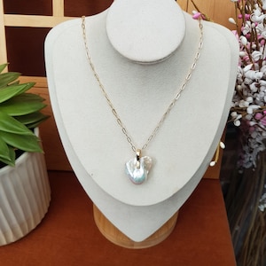 AAA Baroque pearl pendant 20 x 15mm approx. High luster pearl. Each piece is awesome and unique. Chain included. Gift bagged for you.