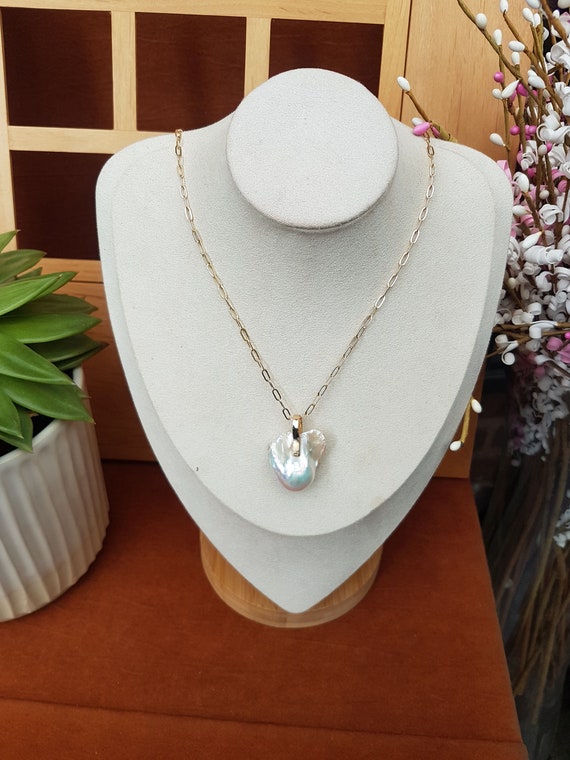 AAA Baroque pearl pendant 25 x 22mm approx. High luster pearl. Each piece is awesome and unique. Chain included. Gift bagged for you.