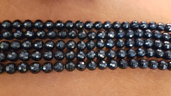 14mm black jade beads. These are faceted, loose and each strand is 15" long, 28 beads per strand. Great sparkle.