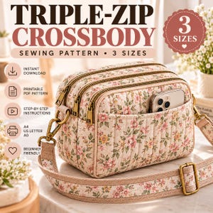 May include: A triple-zip crossbody bag sewing pattern featuring a quilted floral fabric in shades of pink, green, and cream. The bag has three zippered compartments, a front slip pocket holding a smartphone, and an adjustable floral strap.
