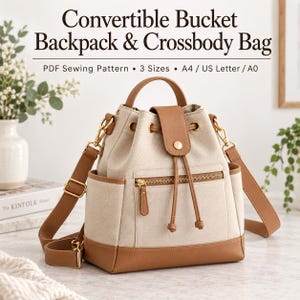 Puede incluir: Un patrón de costura en PDF para mochila tipo cubo convertible y bolso bandolera en 3 tamaños para A4, US Letter y A0. El bolso es de lona beige con ribetes de piel sintética color canela, cierre de cordón, bolsillo frontal con cremallera y herrajes dorados.