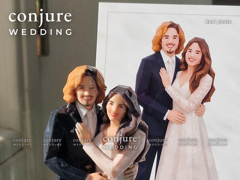 May include: A 3D printed wedding cake topper featuring a couple with a low-poly geometric design. The figure shows a person with shoulder-length brown hair in a dark suit and a person with long dark hair in a white dress. Text reads conjure WEDDING.