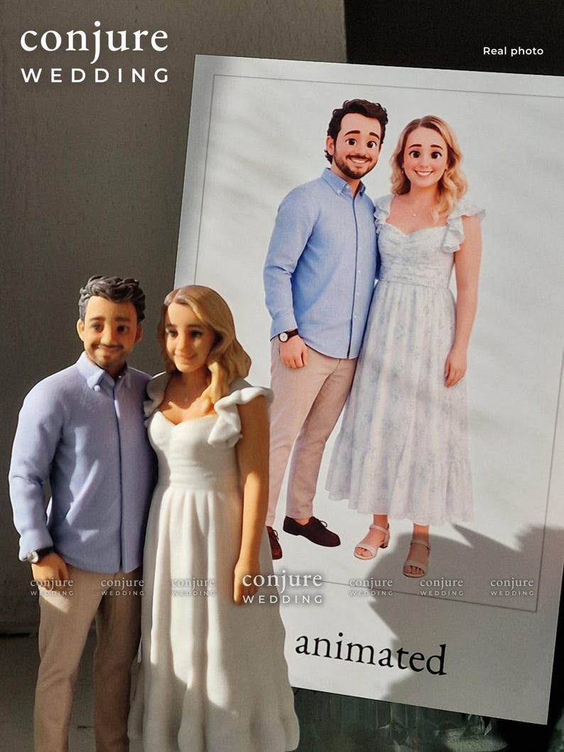 May include: A custom 3D figurine of a couple standing next to a printed photograph of the same pair. The figurine depicts a person in a light blue button-down shirt and tan pants, and a person in a white dress with ruffled sleeves.