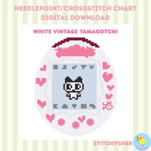 May include: A needlepoint and cross-stitch digital download chart featuring a white vintage Tamagotchi design. The egg-shaped device has a light blue screen with a black pixelated character, surrounded by pink hearts on a white background.