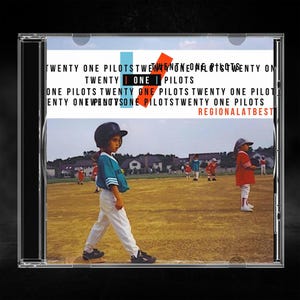 May include: A CD case featuring the album Regional at Best by Twenty One Pilots. The cover art displays a child in a baseball uniform on a field, with the text Twenty One Pilots repeated in the background and the album title in orange.