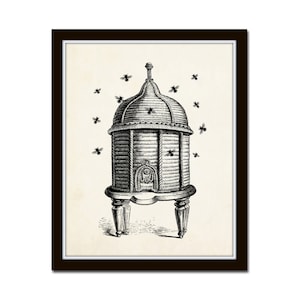 May include: Black and white illustration of a beehive with a domed roof, supported by four legs. Several bees are depicted flying around the hive. The artwork is framed in a dark brown frame.