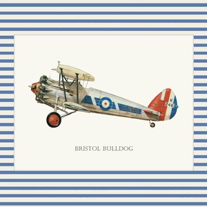 May include: An illustration of a vintage Bristol Bulldog biplane, featuring a silver fuselage, red and blue accents, and a roundel. The plane is set against a cream background, framed by a blue and white striped border. The text "BRISTOL BULLDOG" is below the plane.