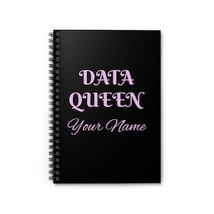 May include: A black spiral-bound notebook featuring the light pink text "DATA QUEEN" in a bold serif font, followed by the light pink script text "Your Name" centred on the front cover. The notebook has a black metal wire coil binding.