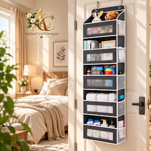 May include: A dark gray over-the-door hanging organizer with six tiers of storage compartments. Each shelf features a clear plastic window for visibility. The unit is constructed with fabric sides and includes side mesh pockets for additional storage.