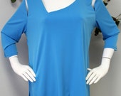 New Plus size tunic with details to the neckline and shoulders.Asymmetrical bottom.