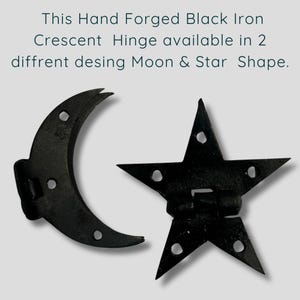 May include: Two hand-forged black iron hinges, one in a crescent moon shape and one in a five-pointed star shape. Each hinge features pre-drilled holes for mounting. The text reads: This Hand Forged Black Iron Crescent Hinge available in 2 diffrent desing Moon & Star Shape.