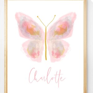 May include: A watercolor painting of a pink butterfly with gold accents. The name Charlotte is written in pink script below the butterfly.