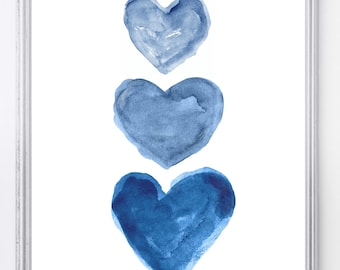 May include: Three watercolor hearts in shades of blue, stacked vertically, on a white background.